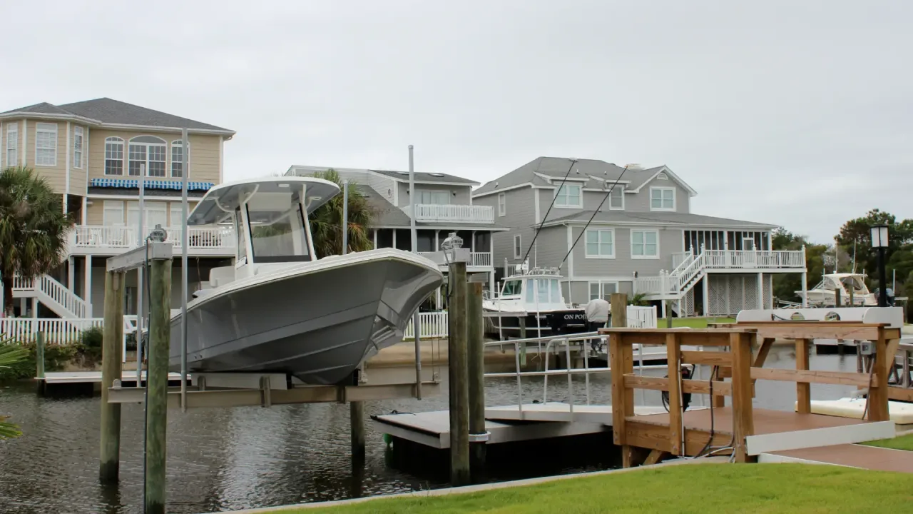 Floating dock, covered pierhead, and boat lift built by Waterbridge in Ocean Isle Beach