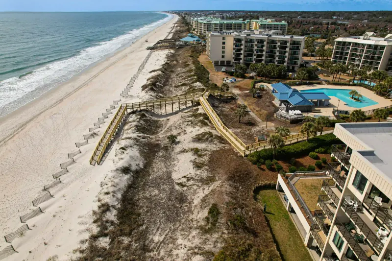 Completed Sandpiper Run dune walkover connecting poolside paths to beach access