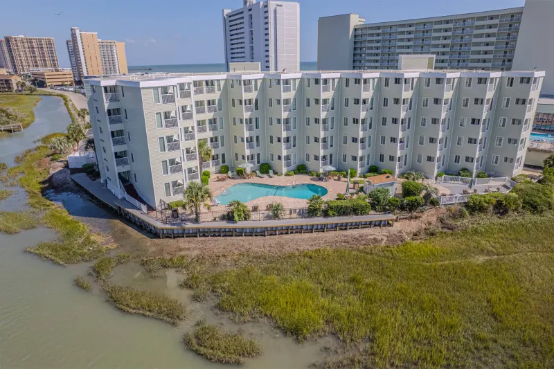 Completed vinyl bulkhead beside the buildings and pool at Sands Beach Club HOA