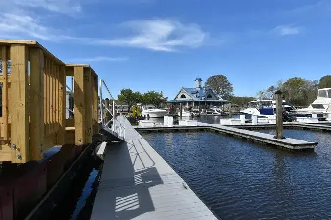 Gangway leading to floating docks and boat slips at Wacca Wache Marina in Murrells Inlet