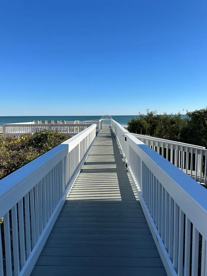 White-railed dune walkover leading directly toward the ocean