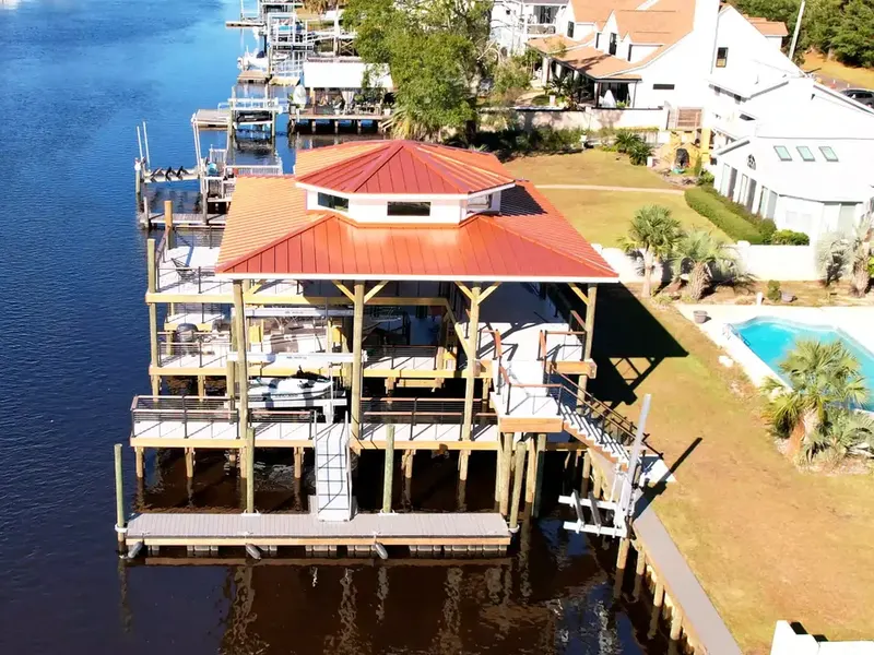 Waterbridge two-story boathouse, boat lift, and fixed dock on the Myrtle Beach Intracoastal Waterway