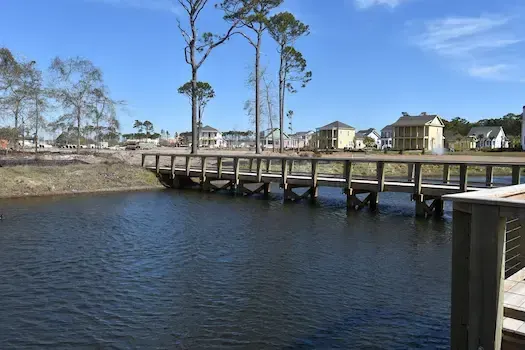 Side view of the timber bridge across the Living Dunes pond