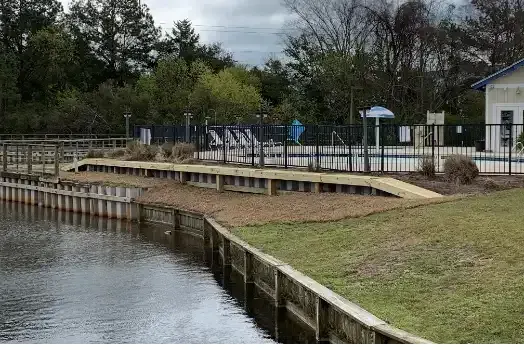 Pond and pool-area setting of the Mingo Town Homes bulkhead project in Litchfield Beach