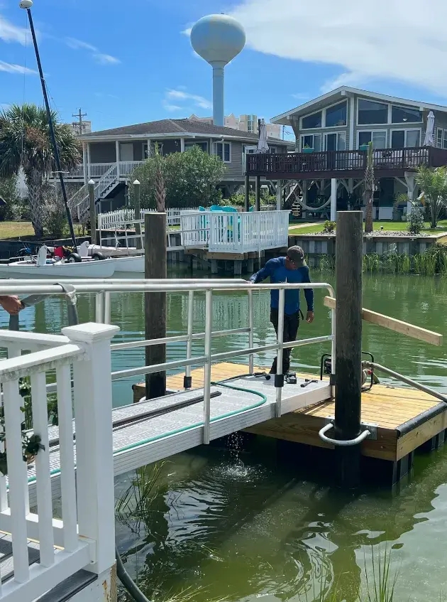 Floating dock installation with an aluminum gangway and guide piles