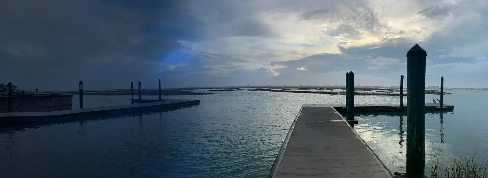 Fixed pier and floating docks extending into a Myrtle Beach coastal waterway