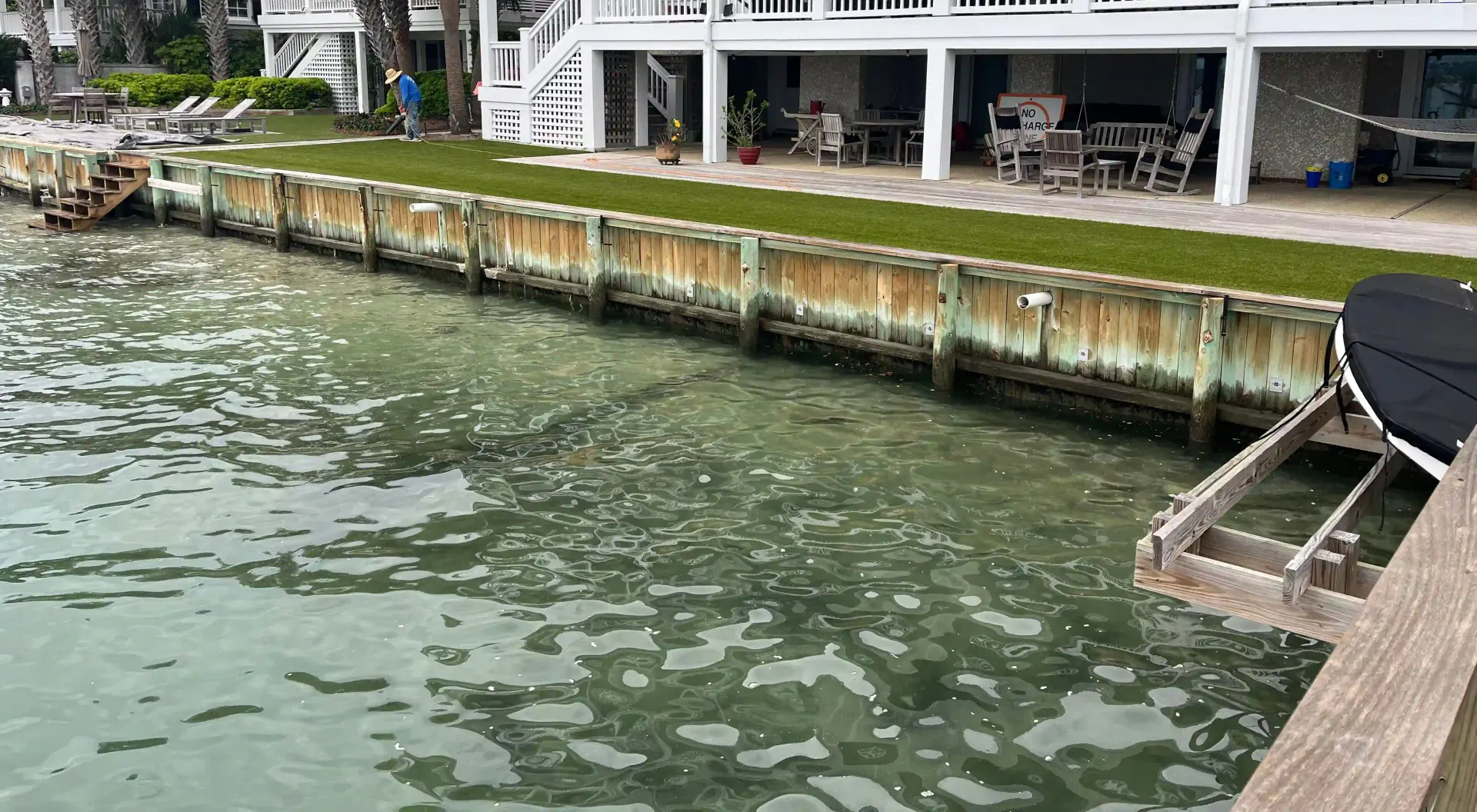 Timber seawall and waterfront home at Waterbridge’s Shore Drive foam repair project in Wrightsville Beach, North Carolina