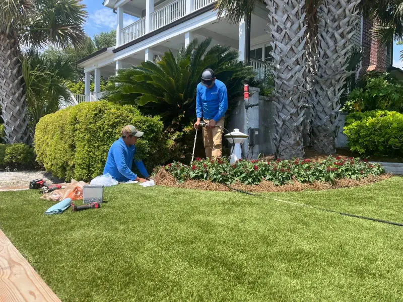 Waterbridge crew working from the lawn beside the Shore Drive seawall