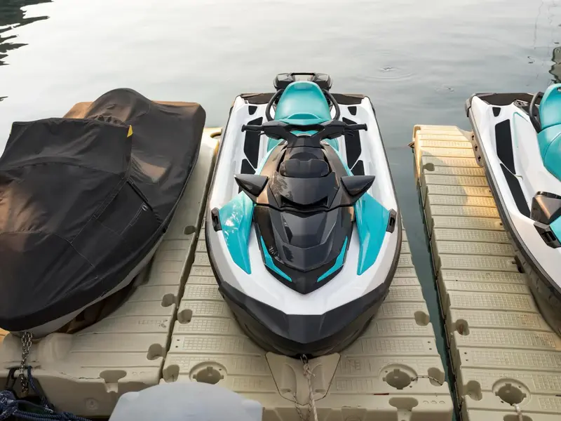 Personal watercraft parked on floating drive-on platforms