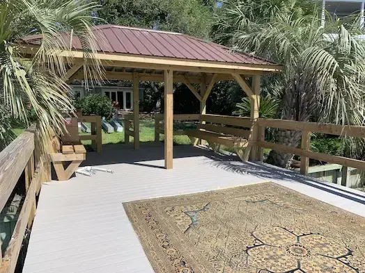 Covered timber pier with walkway and open gathering area in Murrells Inlet