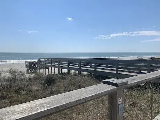 Wooden dune walkover leading to the beach at Litchfield by the Sea