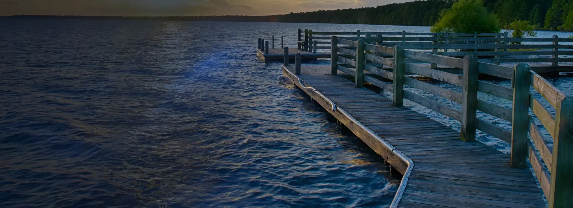 Wooden pier extending across open water