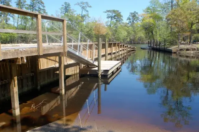 Timber seawall next to a boat slip and deck at Pawleys Island