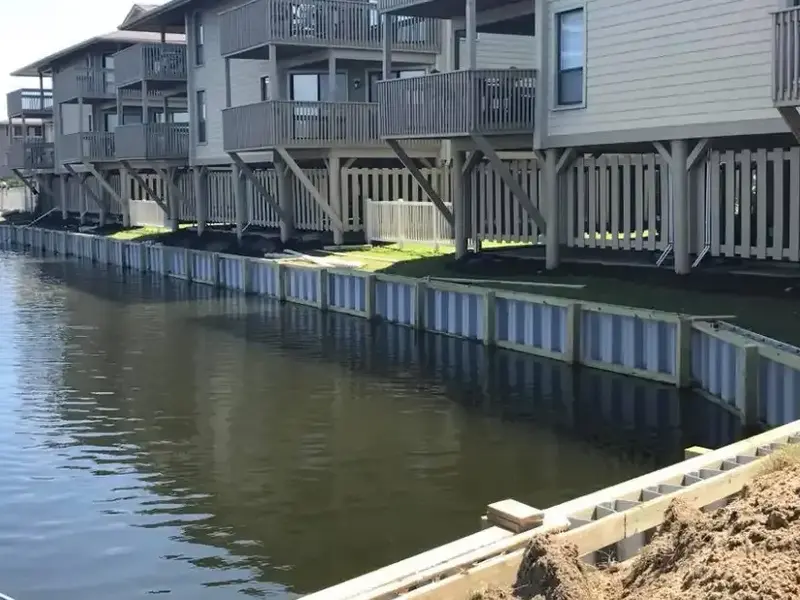 Completed vinyl seawall retaining a residential shoreline