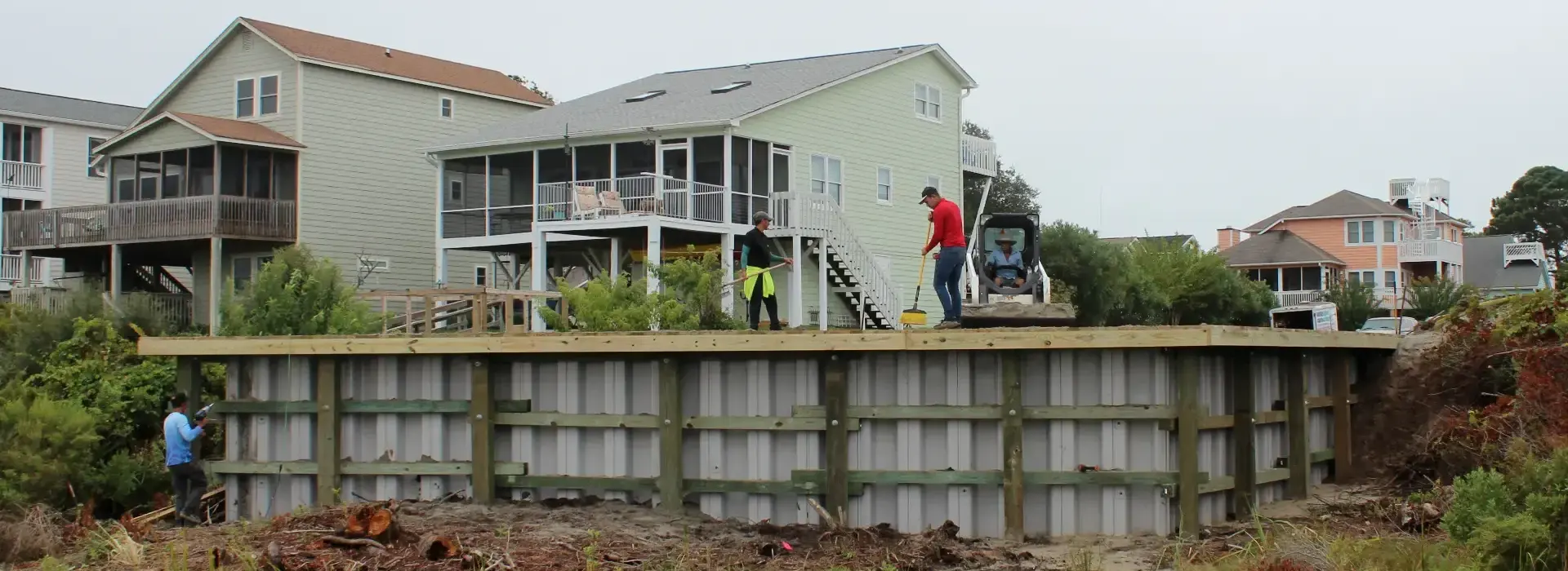 Waterbridge crew working along a residential seawall
