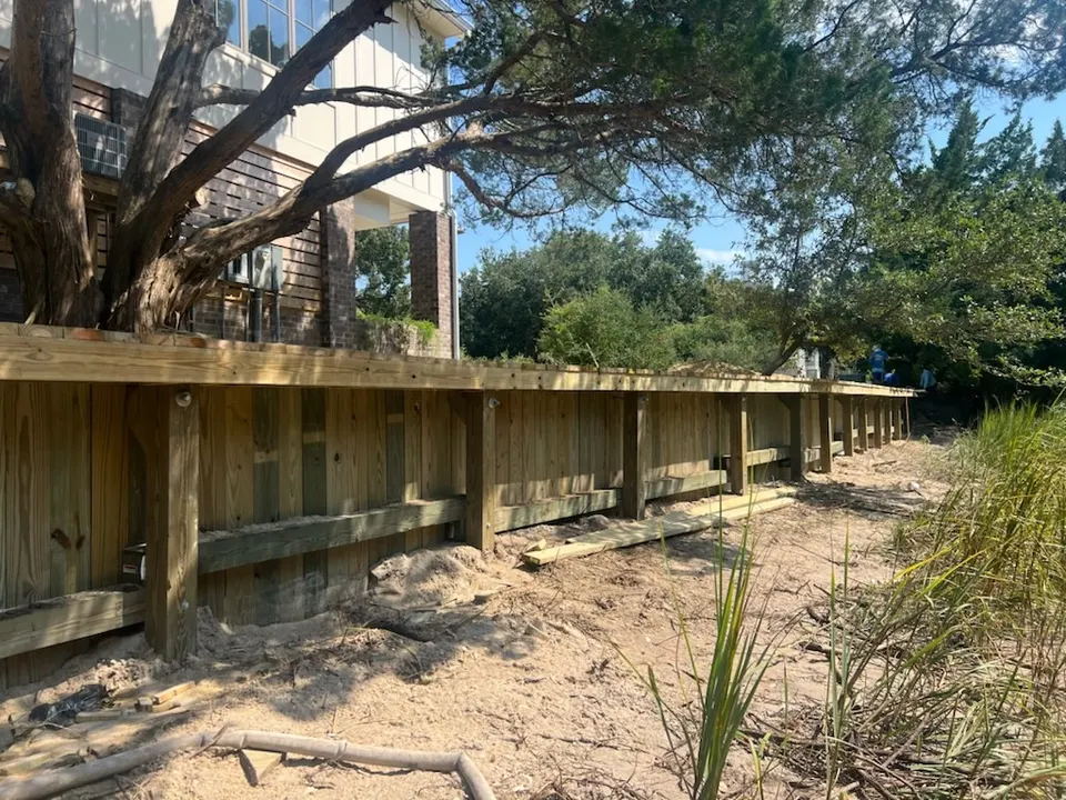 Finished V-groove wood bulkhead at a DeBordieu Colony waterfront home