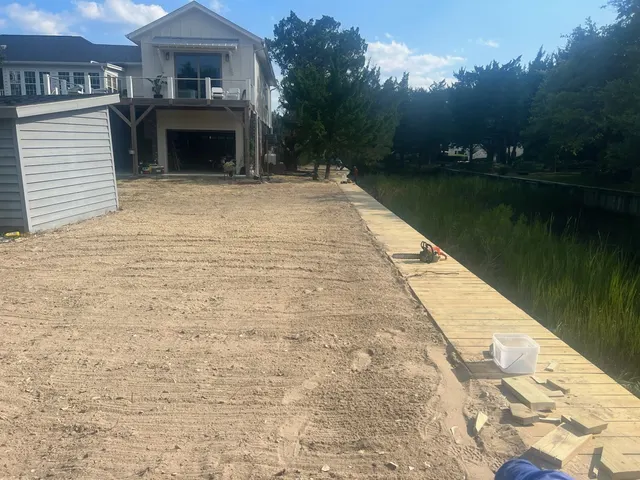 Finished wood bulkhead and boardwalk-style cap at a DeBordieu waterfront home